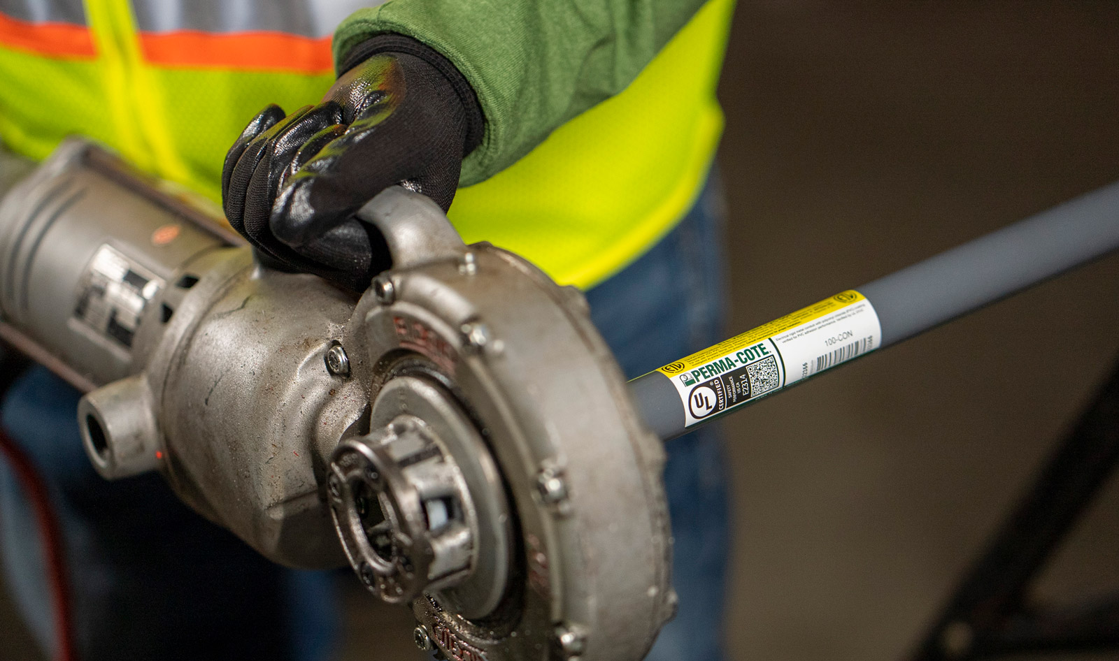 A Contractor Field Threading the PVC-Coated Perma-Cote Conduit